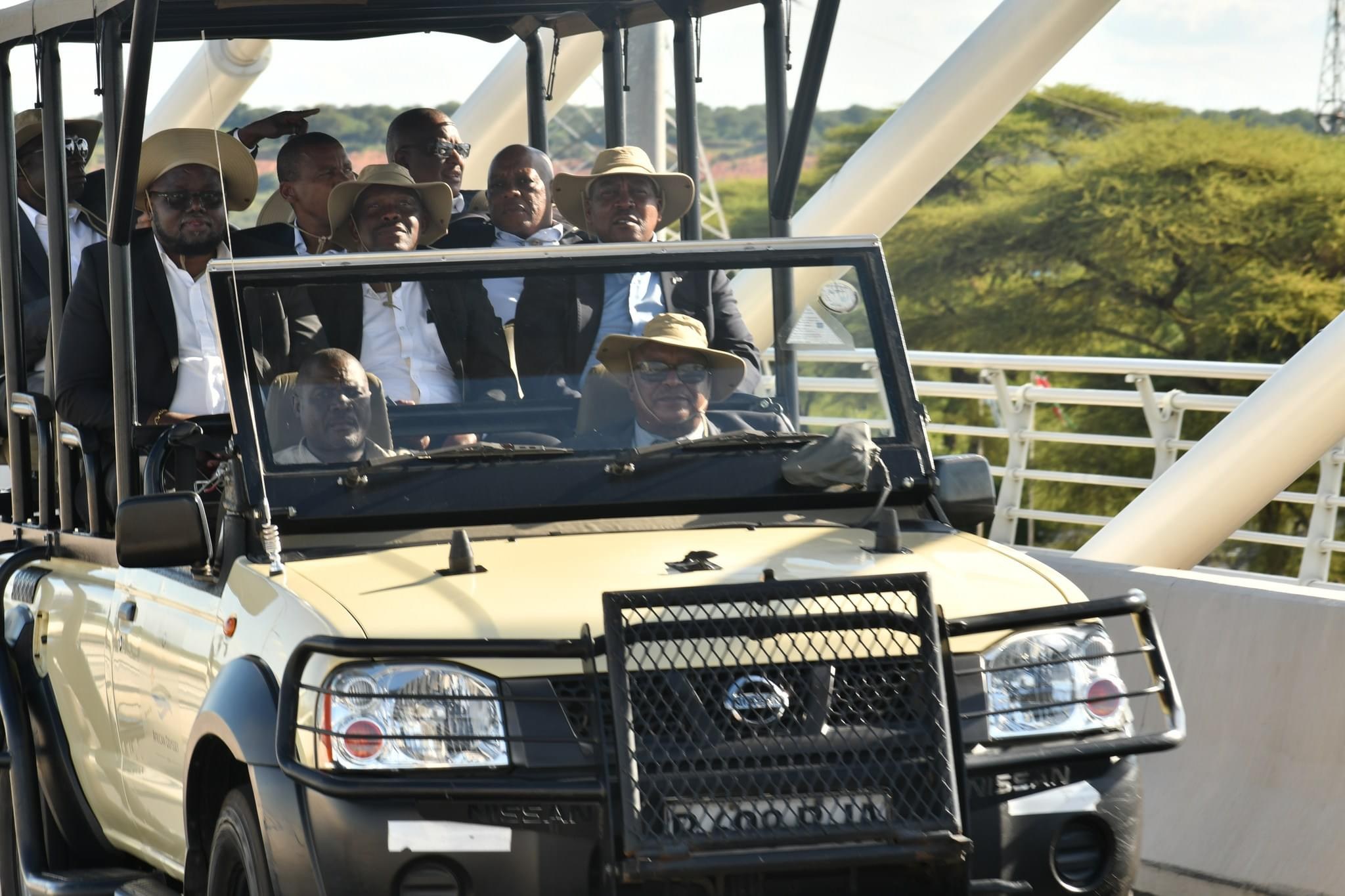 Safari vehicle on Kazungula Bridge with guests